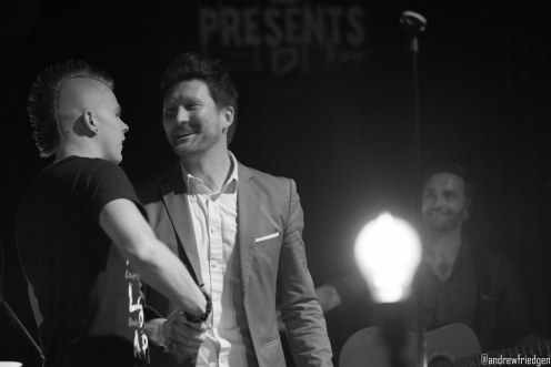 Stephen Christian shakes hands with Cody, who sang part of “The Haunting” with the band.